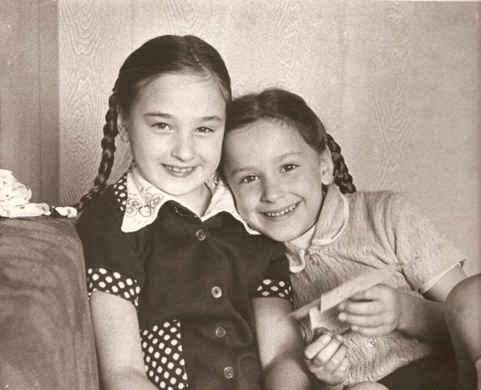 Black and white photo of two young girls, representing historical family connections