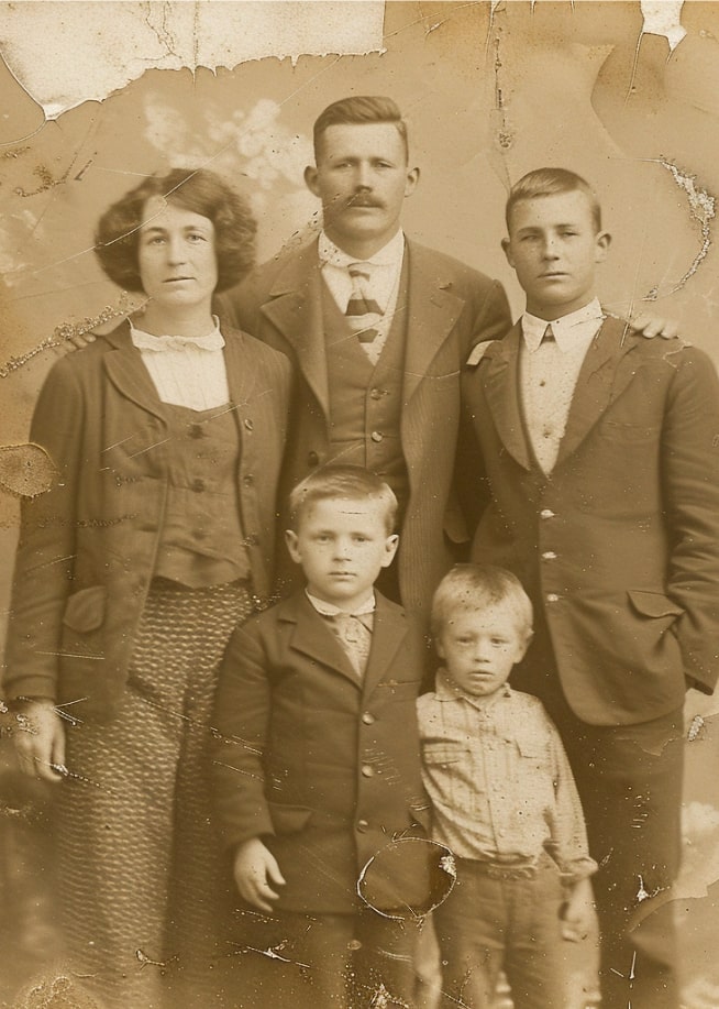 Old photo of a family with three children, illustrating ancestral connections